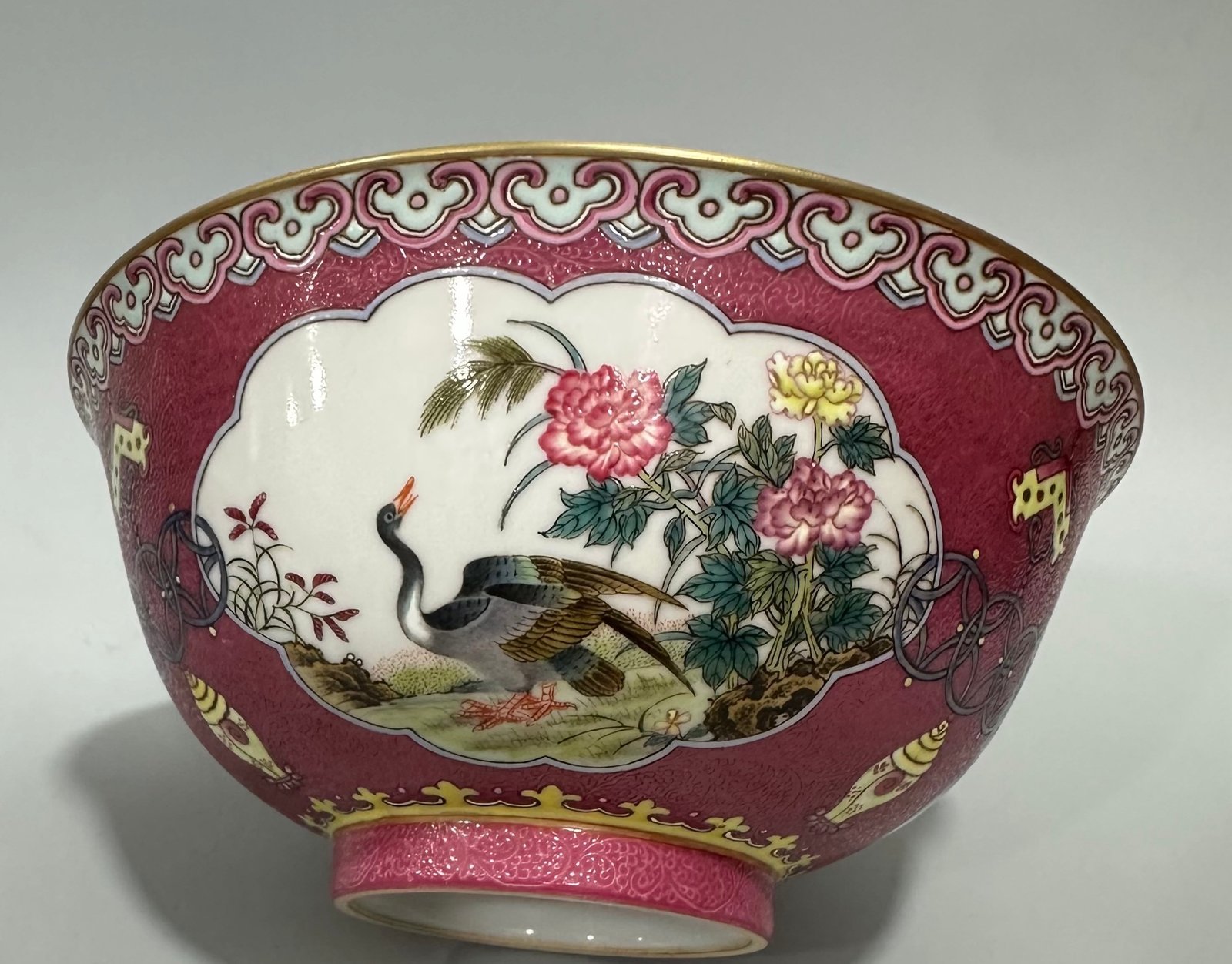 Qing Dynasty Yongzheng Enamel and rouge red orbital windowed bowl with flower and bird