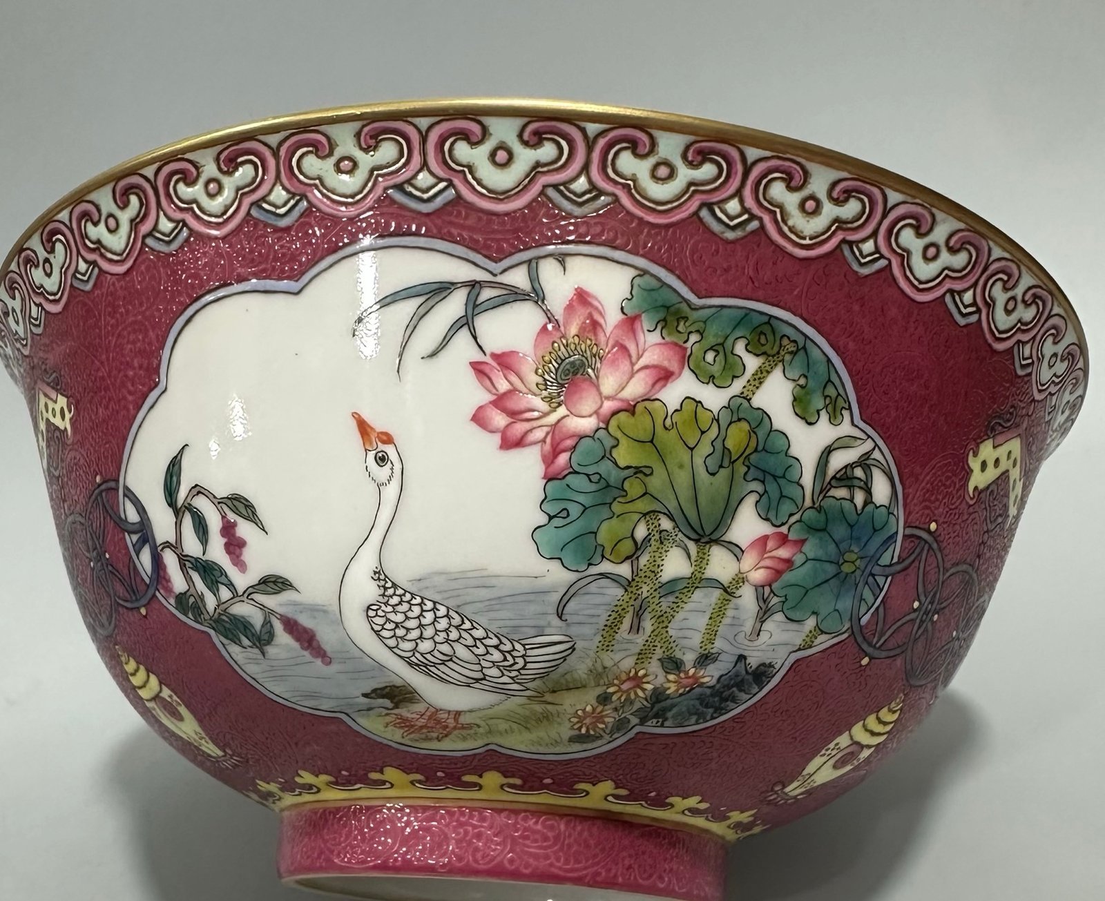 Qing Dynasty Yongzheng Enamel and rouge red orbital windowed bowl with flower and bird