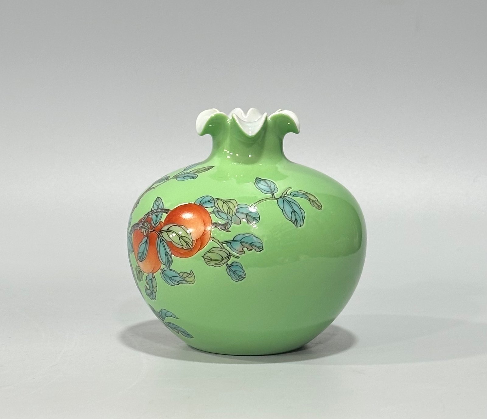 Qing Dynasty Yongzheng Enamel apple green glaze pomegranate statue with everything goes well pattern