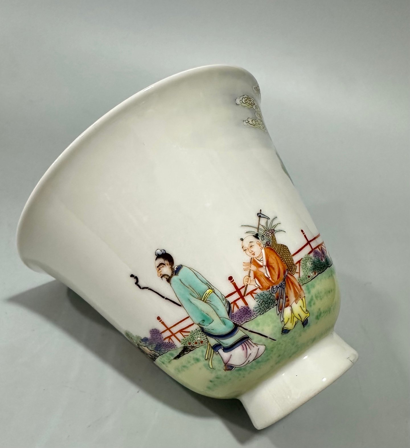 Qing Dynasty Yongzheng a pastel cup with a figure and a scholar