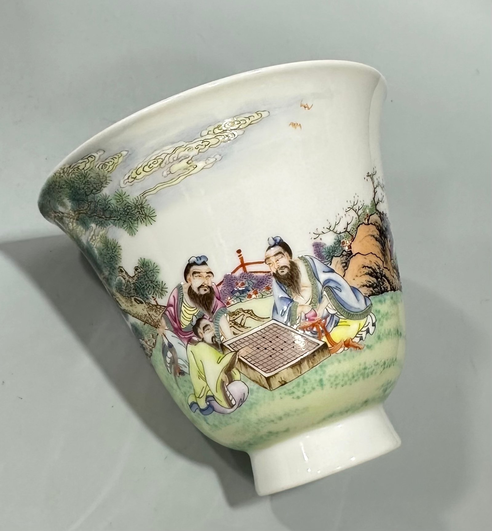 Qing Dynasty Yongzheng a pastel cup with a figure and a scholar