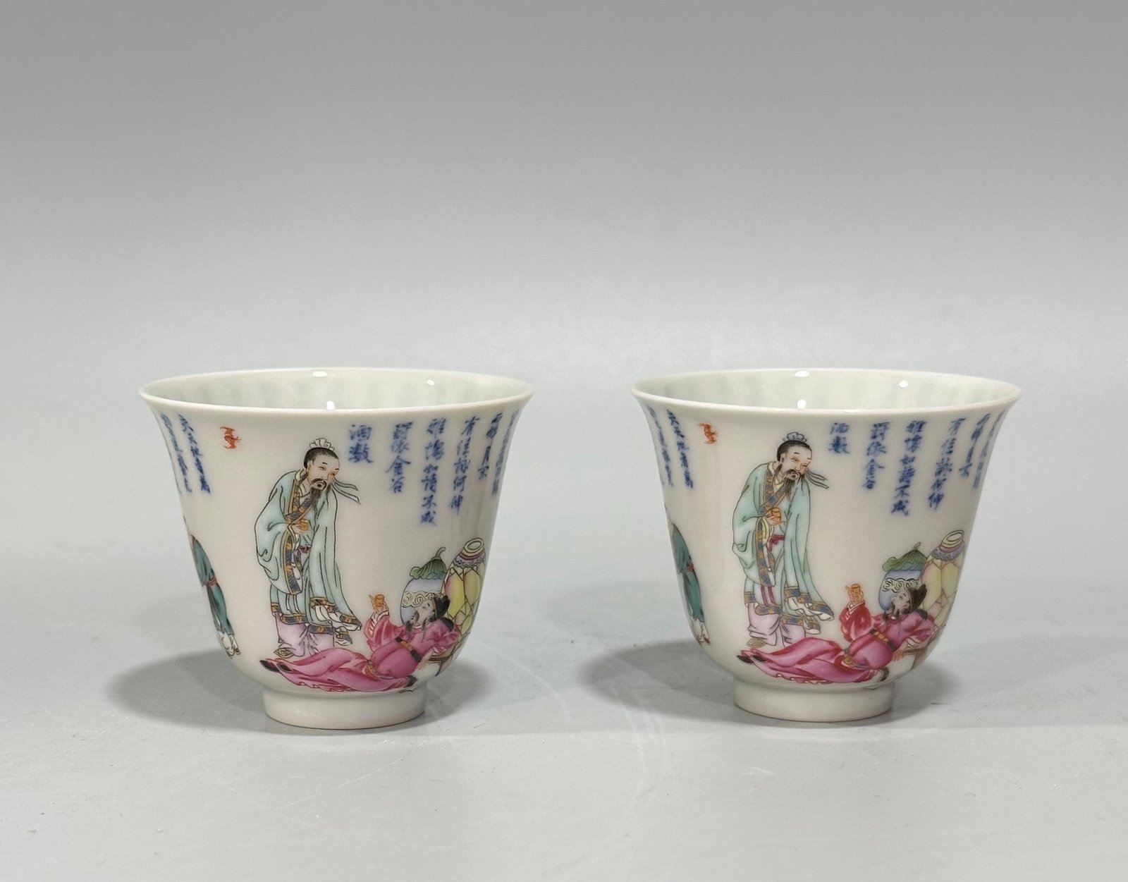 Qing Dynasty Yongzheng Pastel blue and white poetry cup with figures drinking from immortals