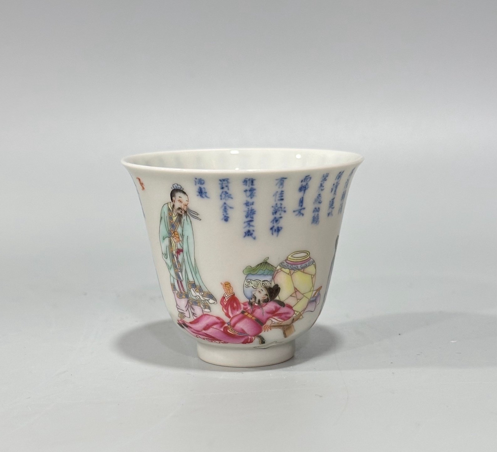Qing Dynasty Yongzheng Pastel blue and white poetry cup with figures drinking from immortals
