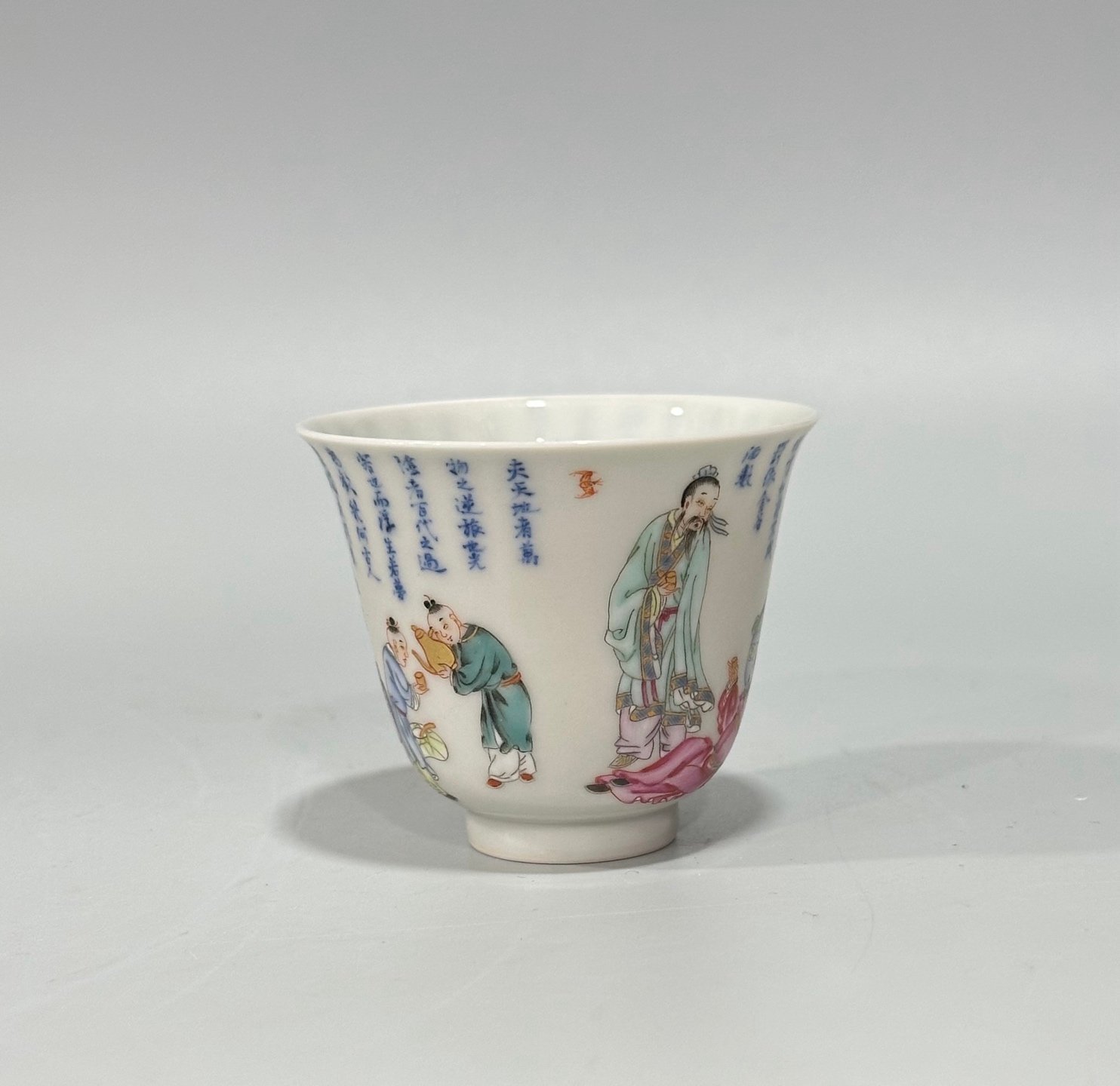 Qing Dynasty Yongzheng Pastel blue and white poetry cup with figures drinking from immortals