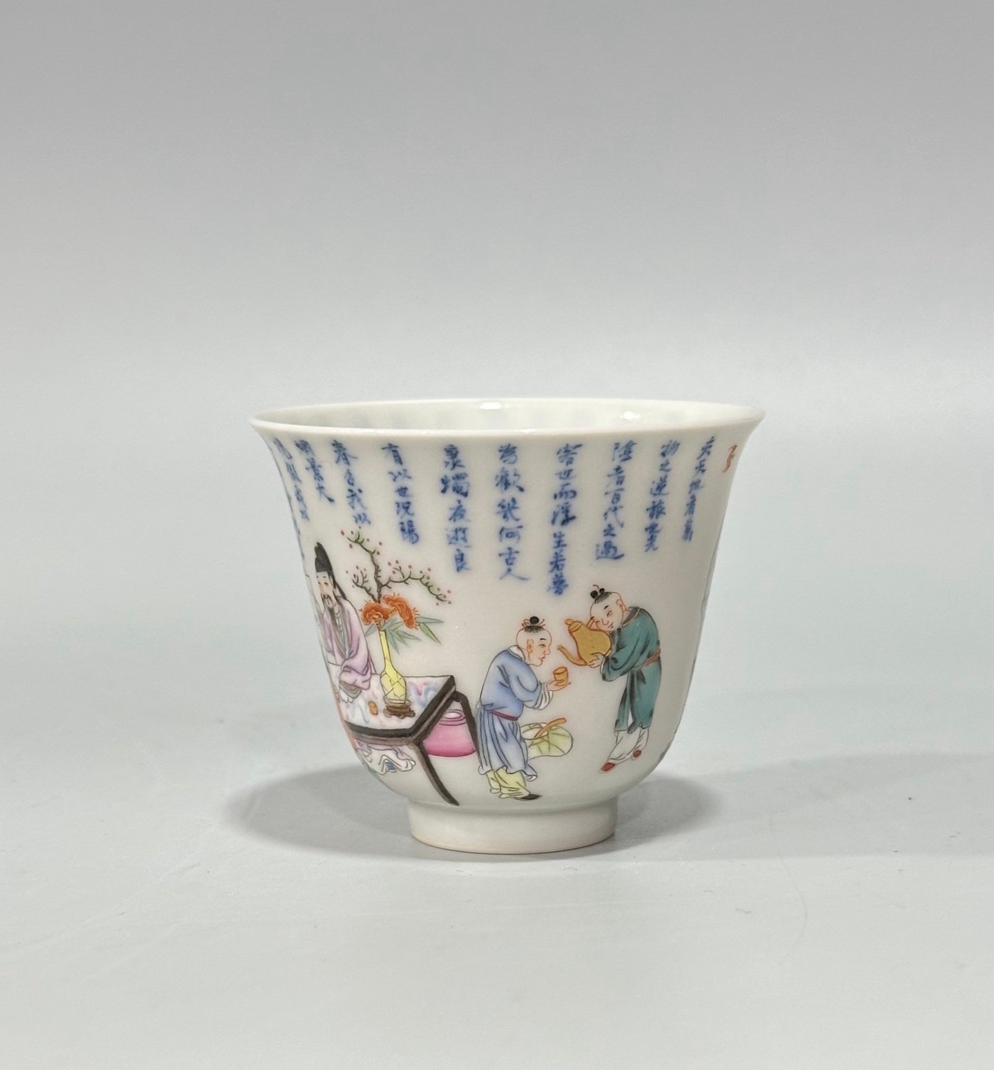 Qing Dynasty Yongzheng Pastel blue and white poetry cup with figures drinking from immortals
