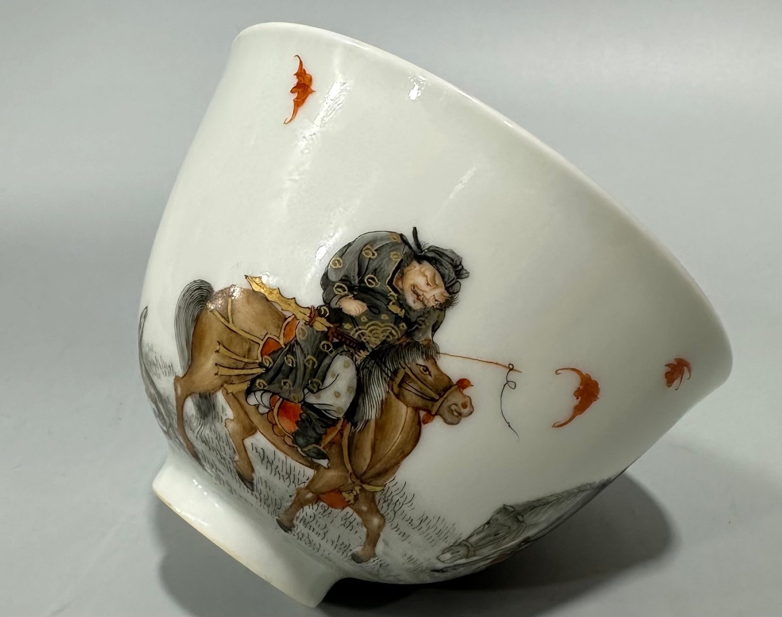 Qing Dynasty Yongzheng Red ink and gold painted figure hunting cup