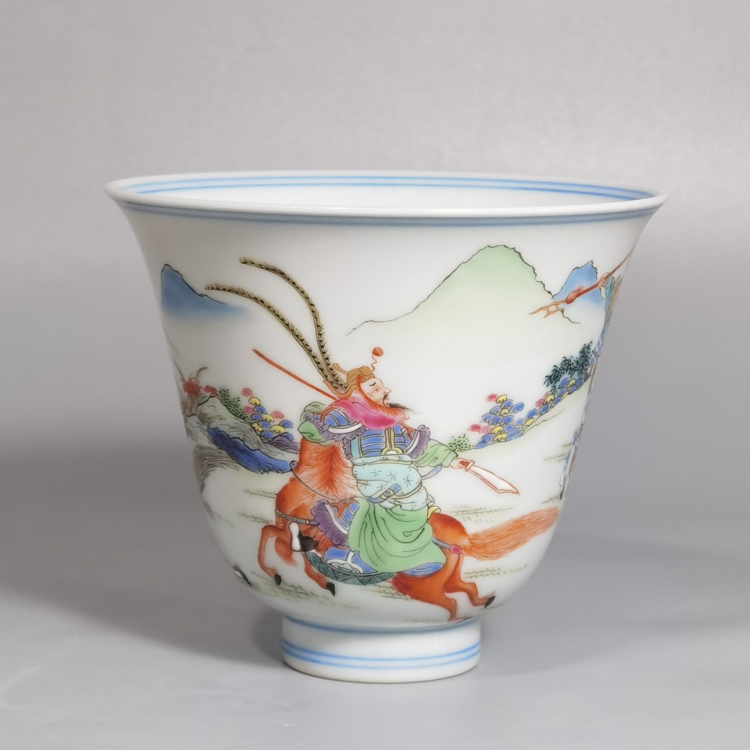 Qing Dynasty Yongzheng a pastel colored saber and horse figure warrior bell cup