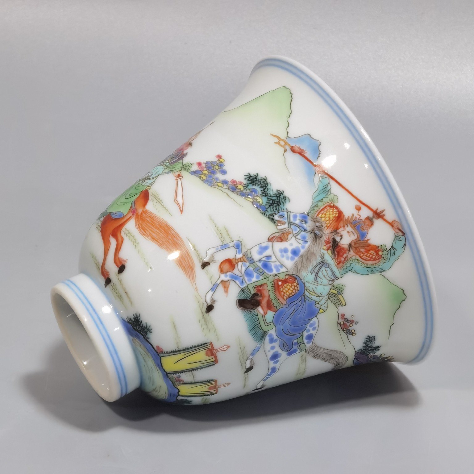 Qing Dynasty Yongzheng a pastel colored saber and horse figure warrior bell cup