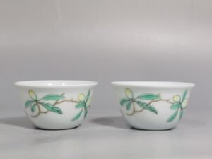Qing Dynasty Yongzheng A pair of pastel flower and butterfly cups made during
