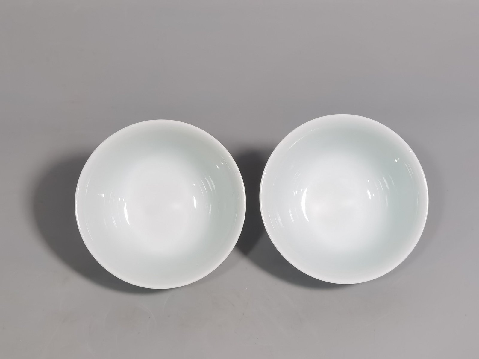 Qing Dynasty Yongzheng A pair of pastel flower and butterfly cups made during