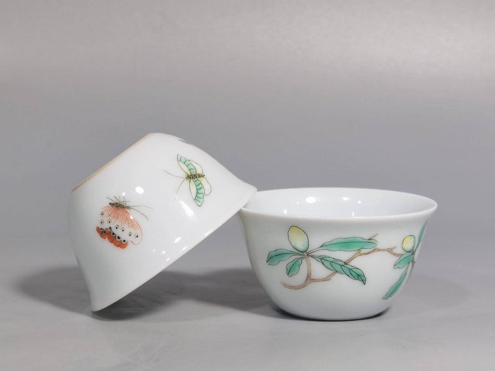 Qing Dynasty Yongzheng A pair of pastel flower and butterfly cups made during