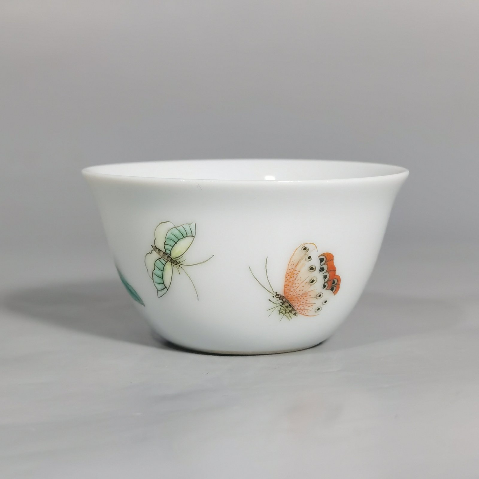 Qing Dynasty Yongzheng A pair of pastel flower and butterfly cups made during