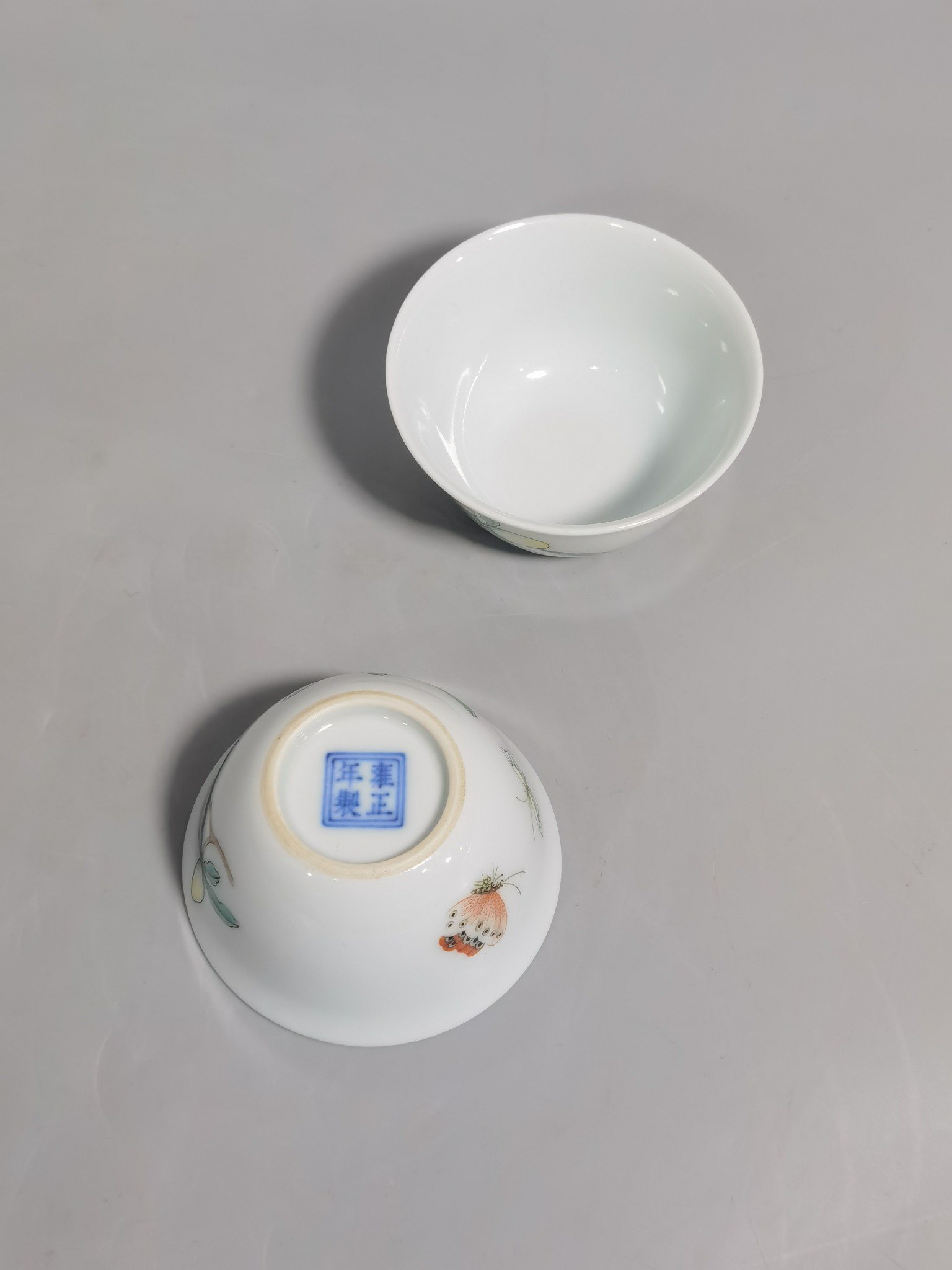 Qing Dynasty Yongzheng A pair of pastel flower and butterfly cups made during