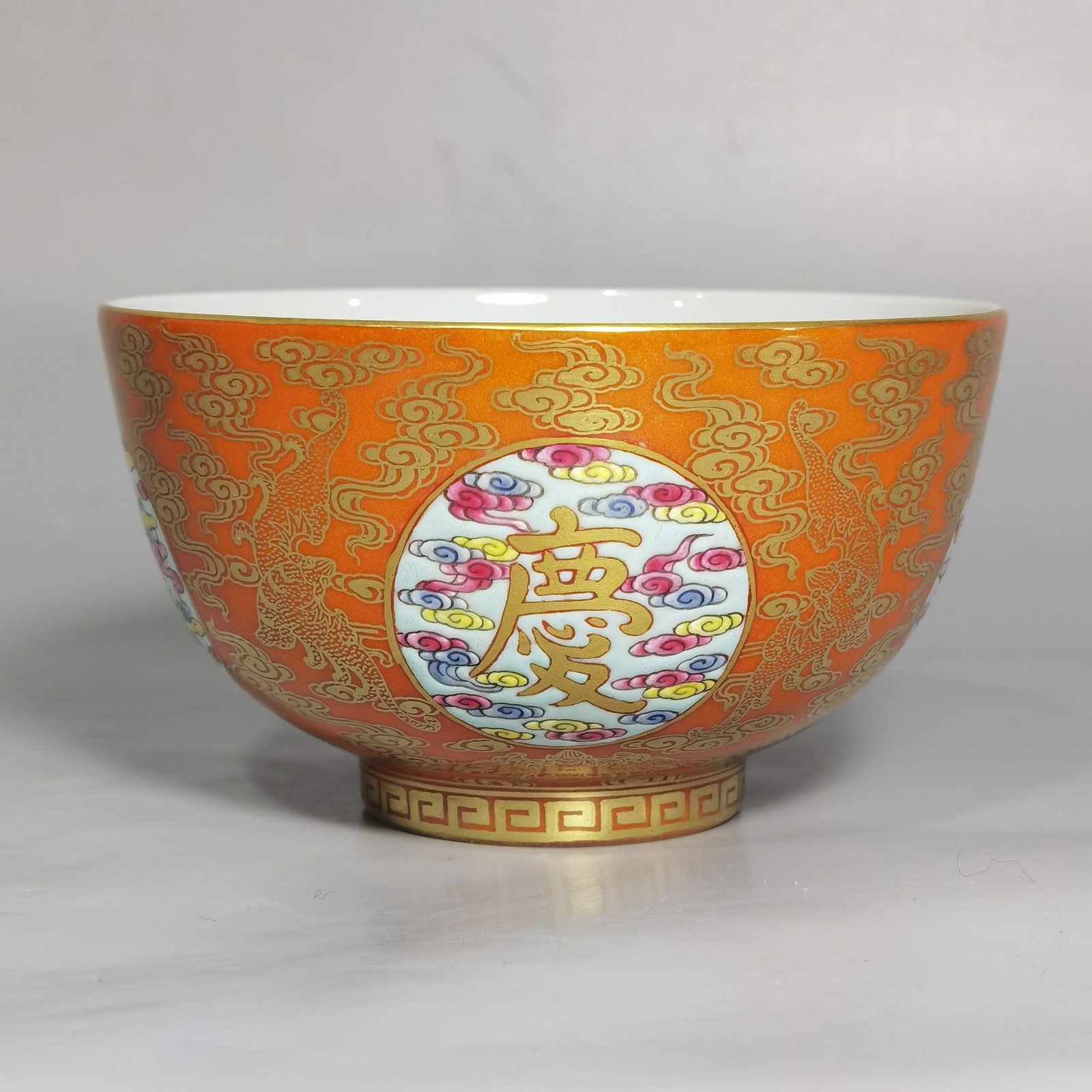 Qing Dynasty Yongzheng Pastel gold on coral red ground Open window to celebrate every year Pair of bowls