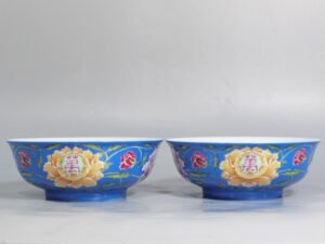 Qing Dynasty Yongzheng A pair of enamel blue ground peony bowls