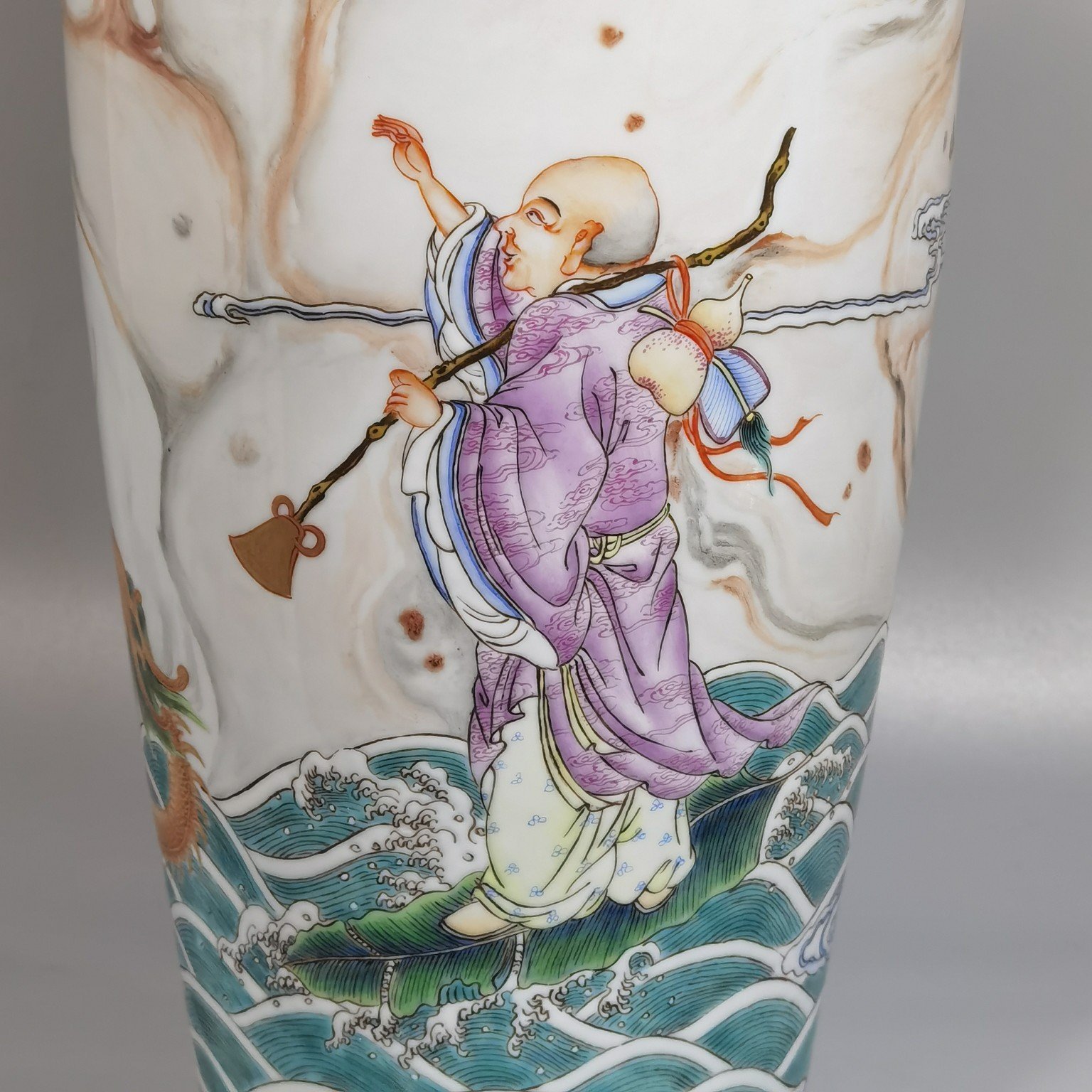 Qing Dynasty Yongzheng cloud pattern pastel color Guanyin bottle with picture of Arhat subduing the dragon