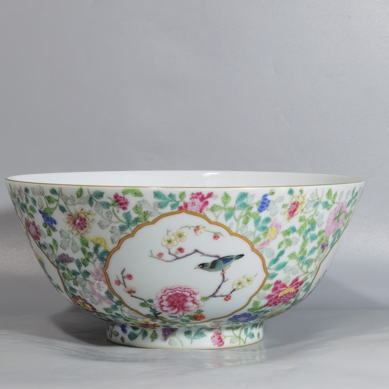 Qing Dynasty Yongzheng famille rose window flower and bird bowl