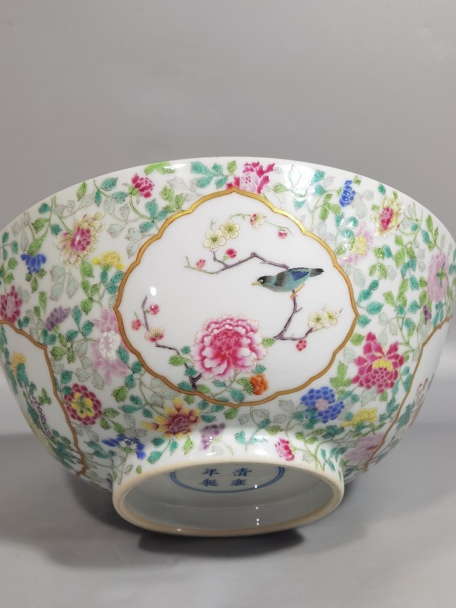 Qing Dynasty Yongzheng famille rose window flower and bird bowl