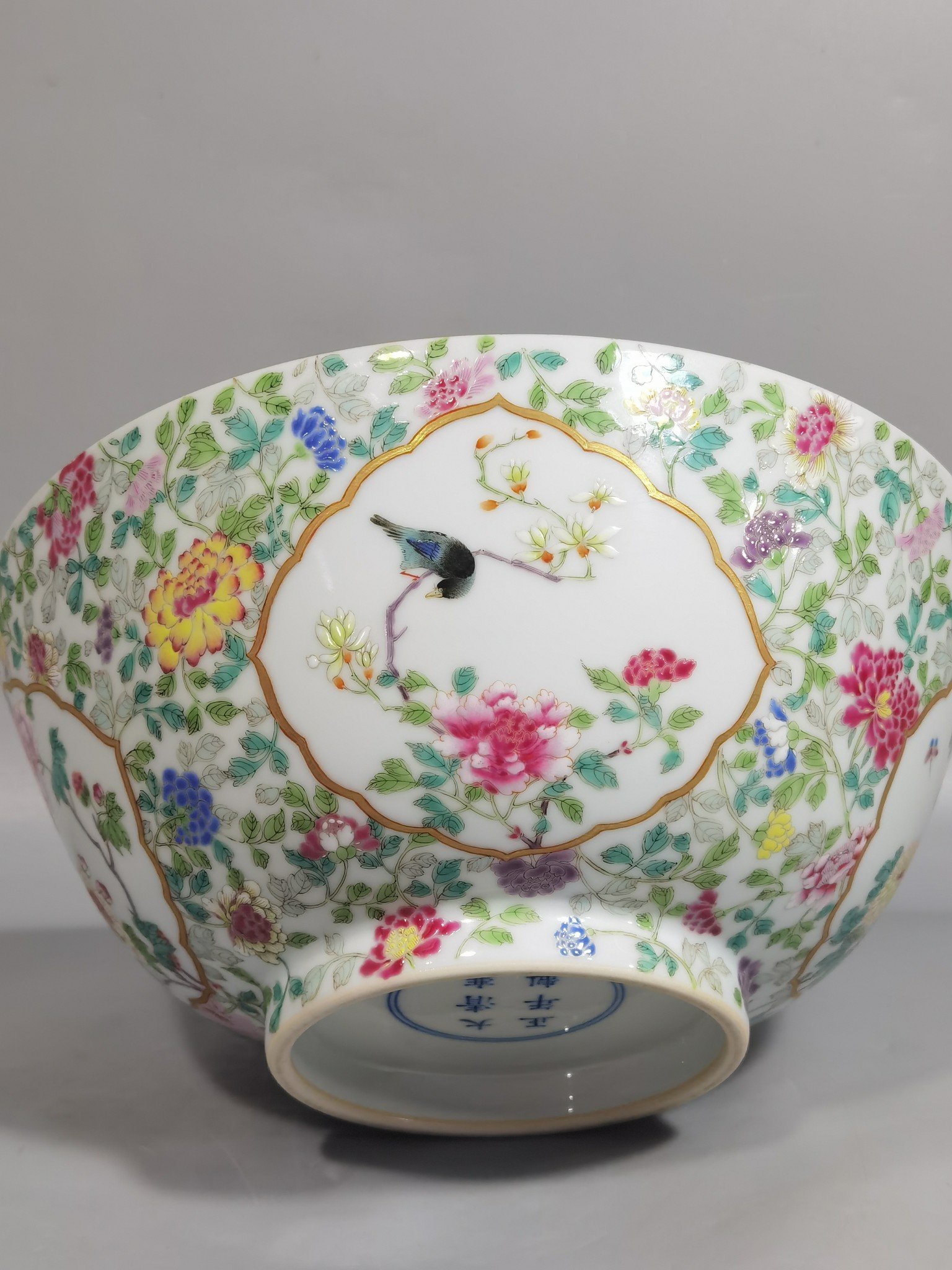 Qing Dynasty Yongzheng famille rose window flower and bird bowl