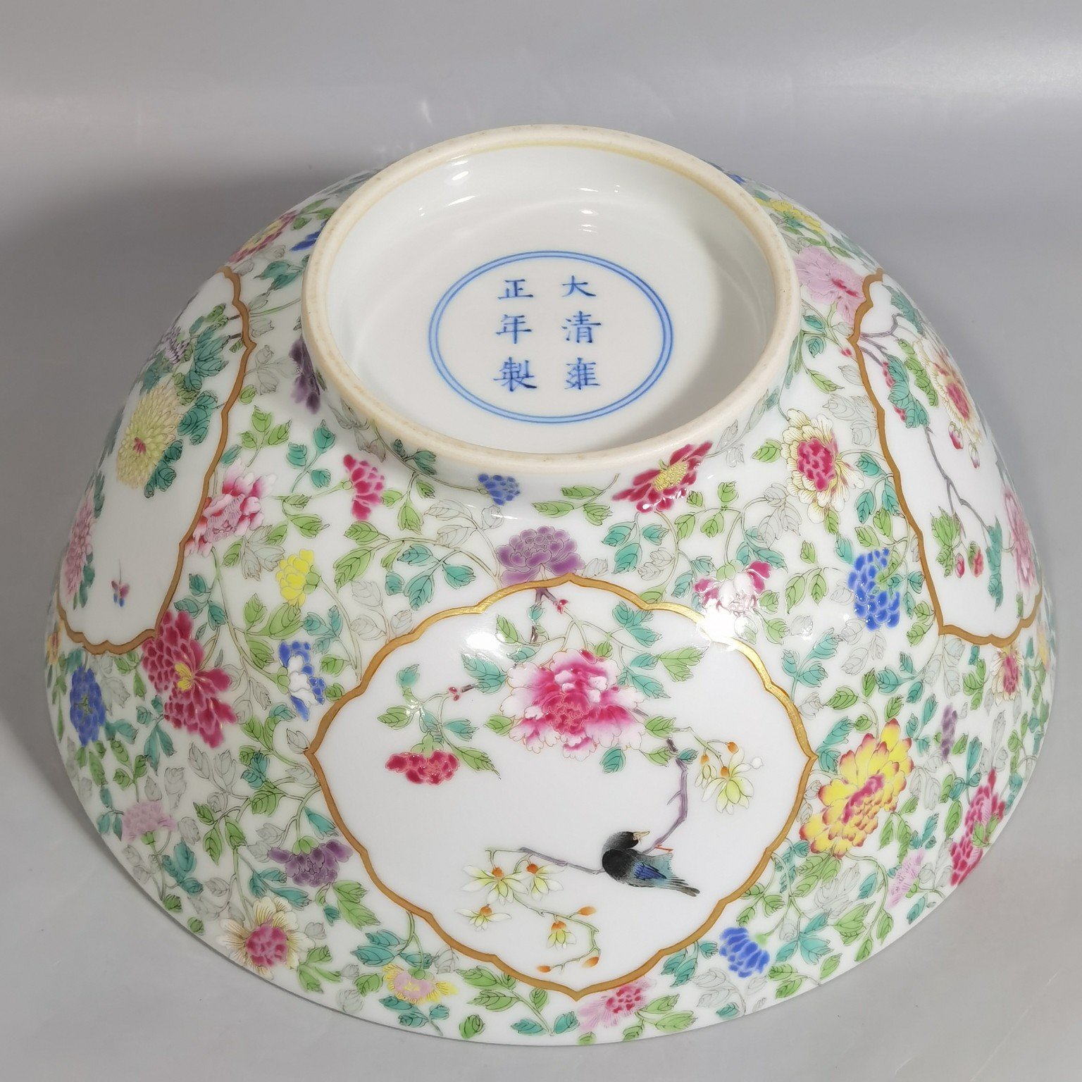Qing Dynasty Yongzheng famille rose window flower and bird bowl