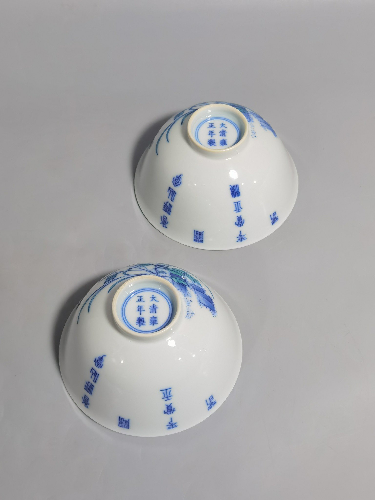 Qing Dynasty Yongzheng Three Autumns cups in underglaze blue and doucai enamels