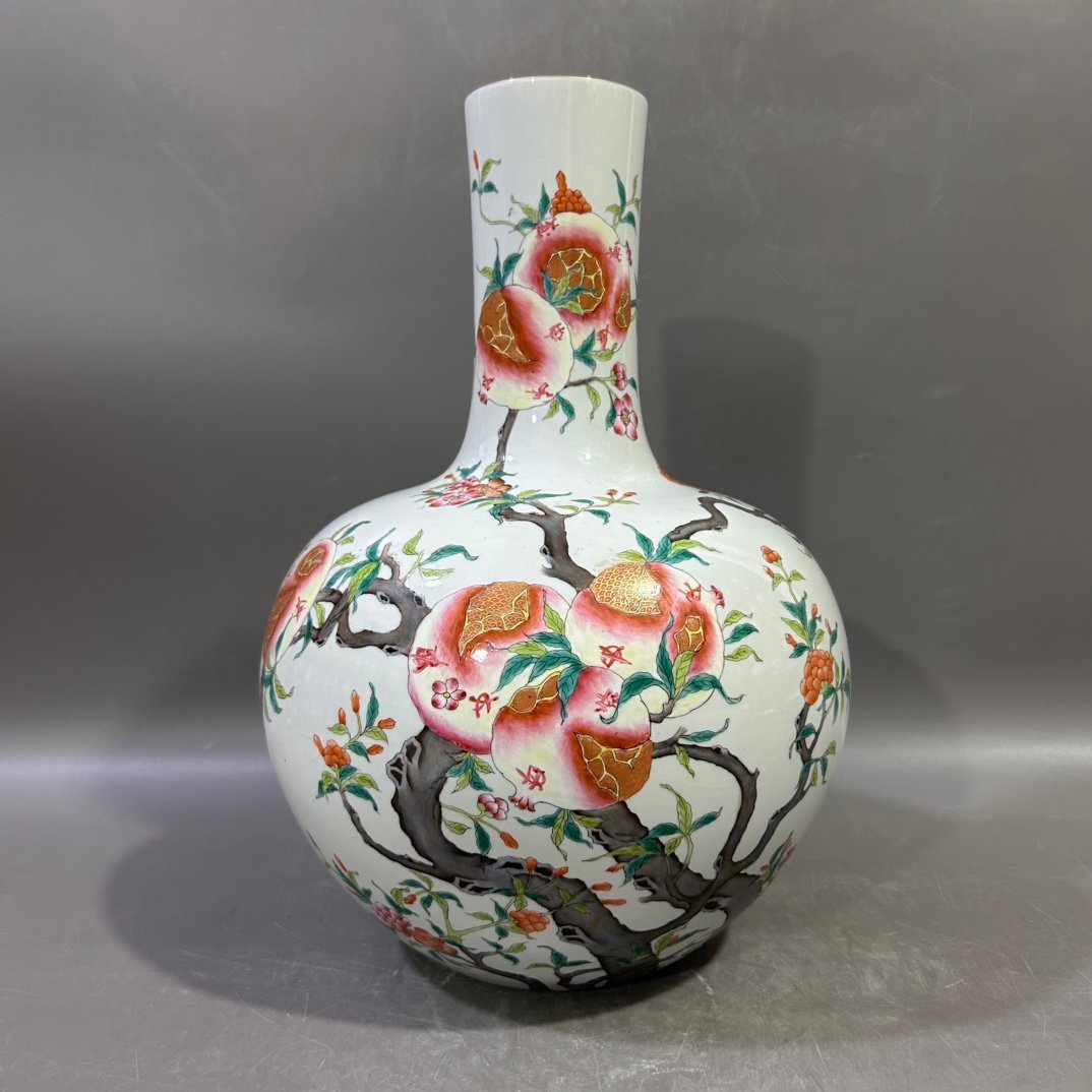 Qing Dynasty Yongzheng famille rose pomegranate celestial sphere vase
