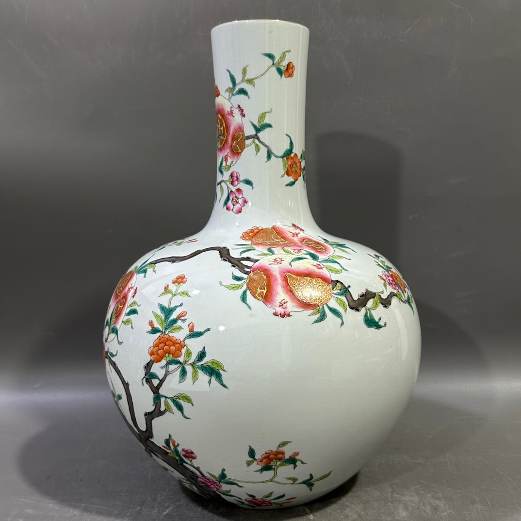 Qing Dynasty Yongzheng famille rose pomegranate celestial sphere vase