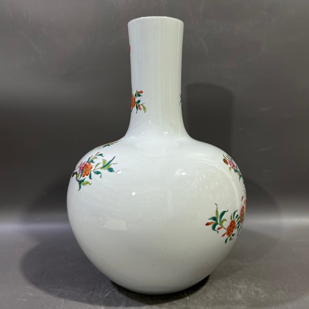 Qing Dynasty Yongzheng famille rose pomegranate celestial sphere vase