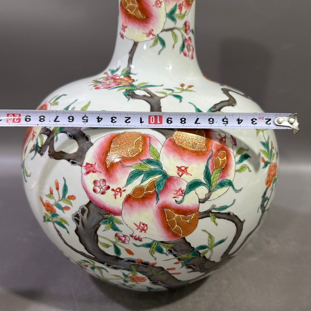 Qing Dynasty Yongzheng famille rose pomegranate celestial sphere vase