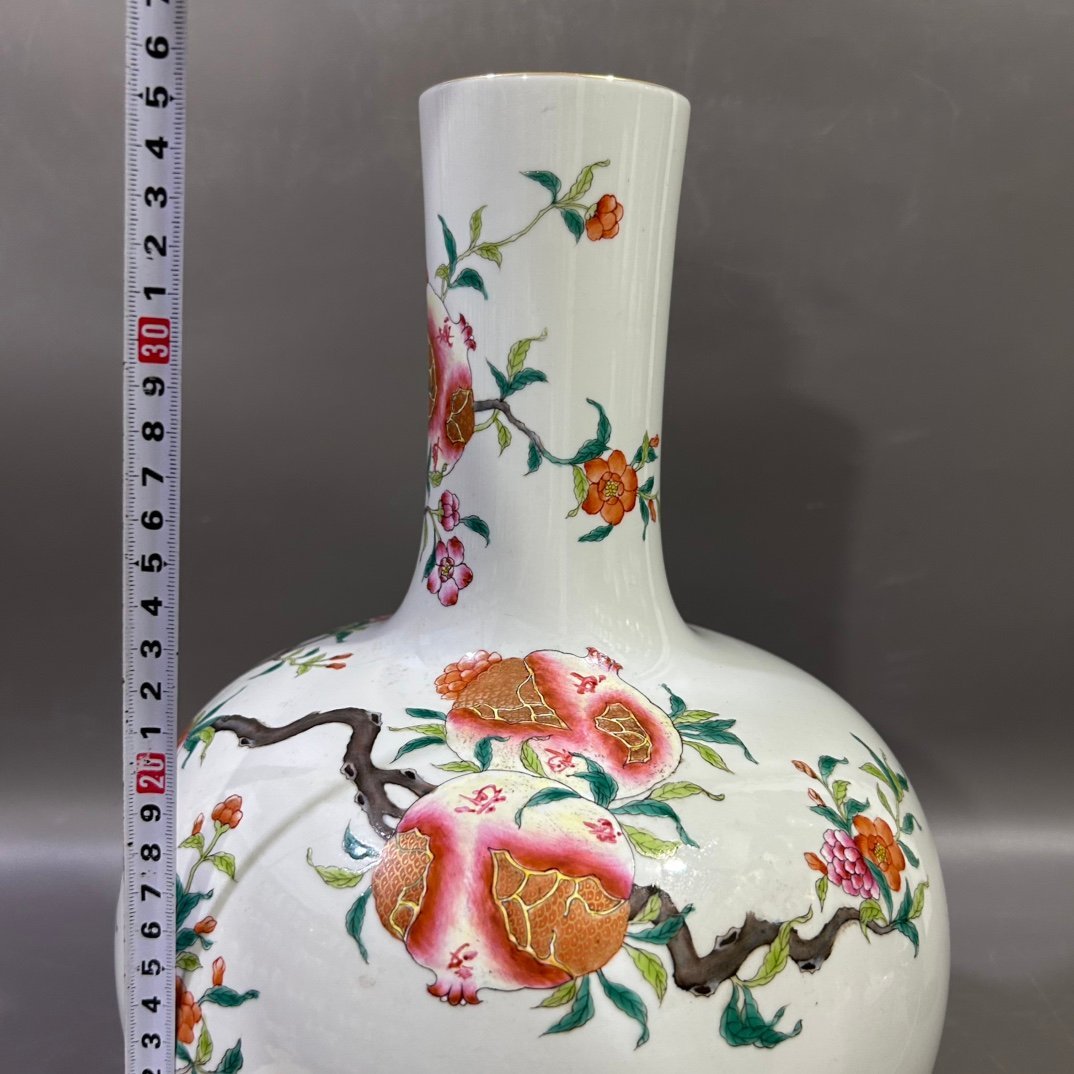 Qing Dynasty Yongzheng famille rose pomegranate celestial sphere vase