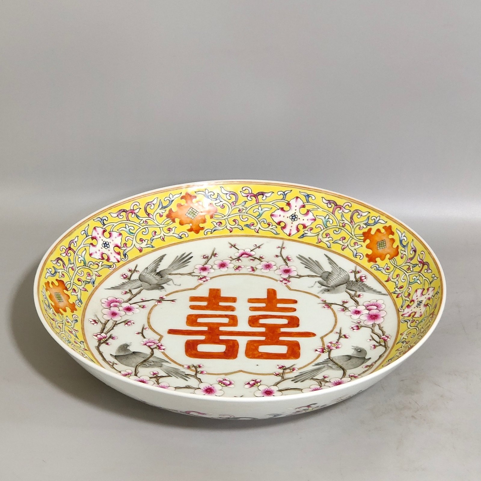 Qing Dynasty Yongzheng yellow ground flower and bird dish