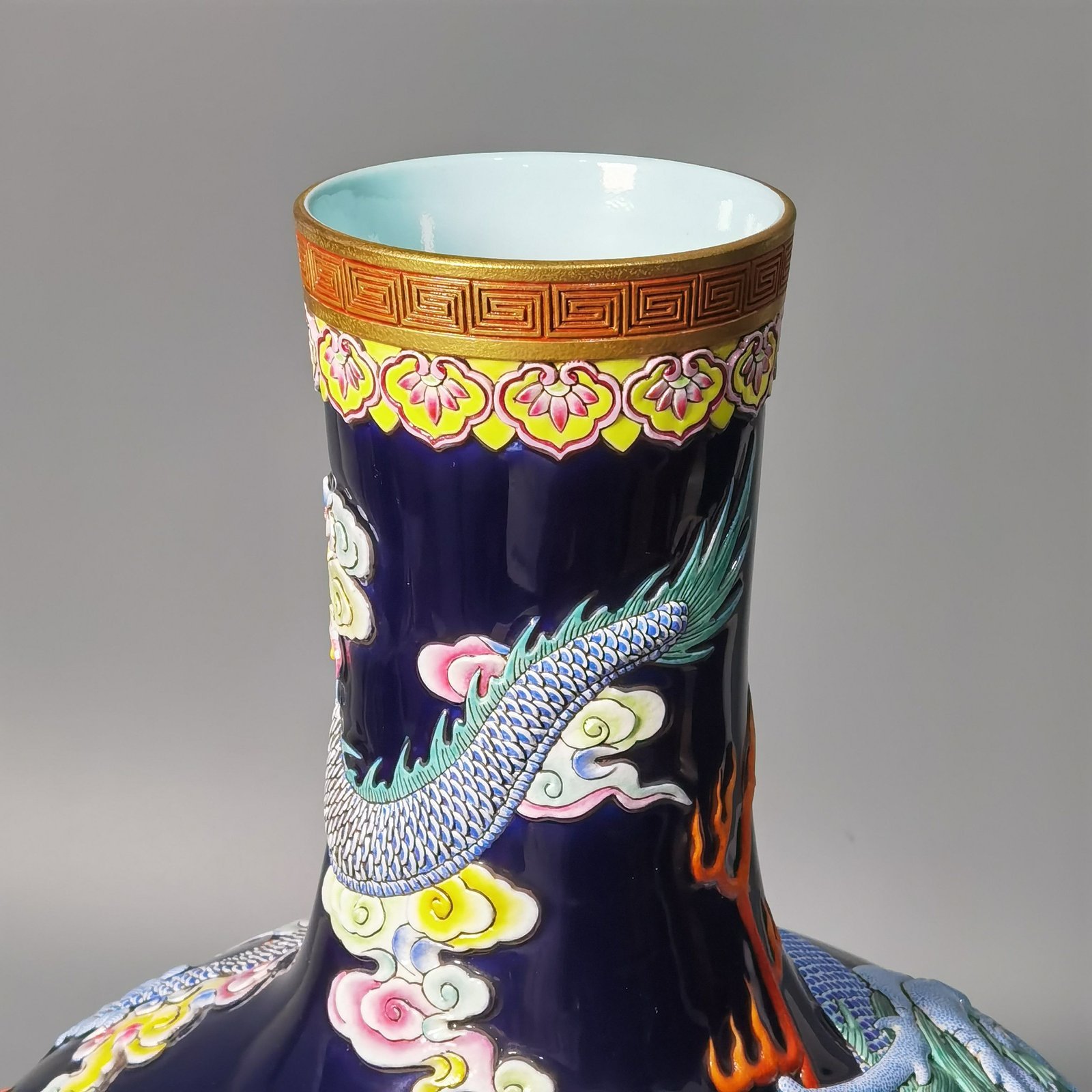 Qing Dynasty Qianlong blue glaze carving pastel gold-painted sea water dragon celestial sphere bottle