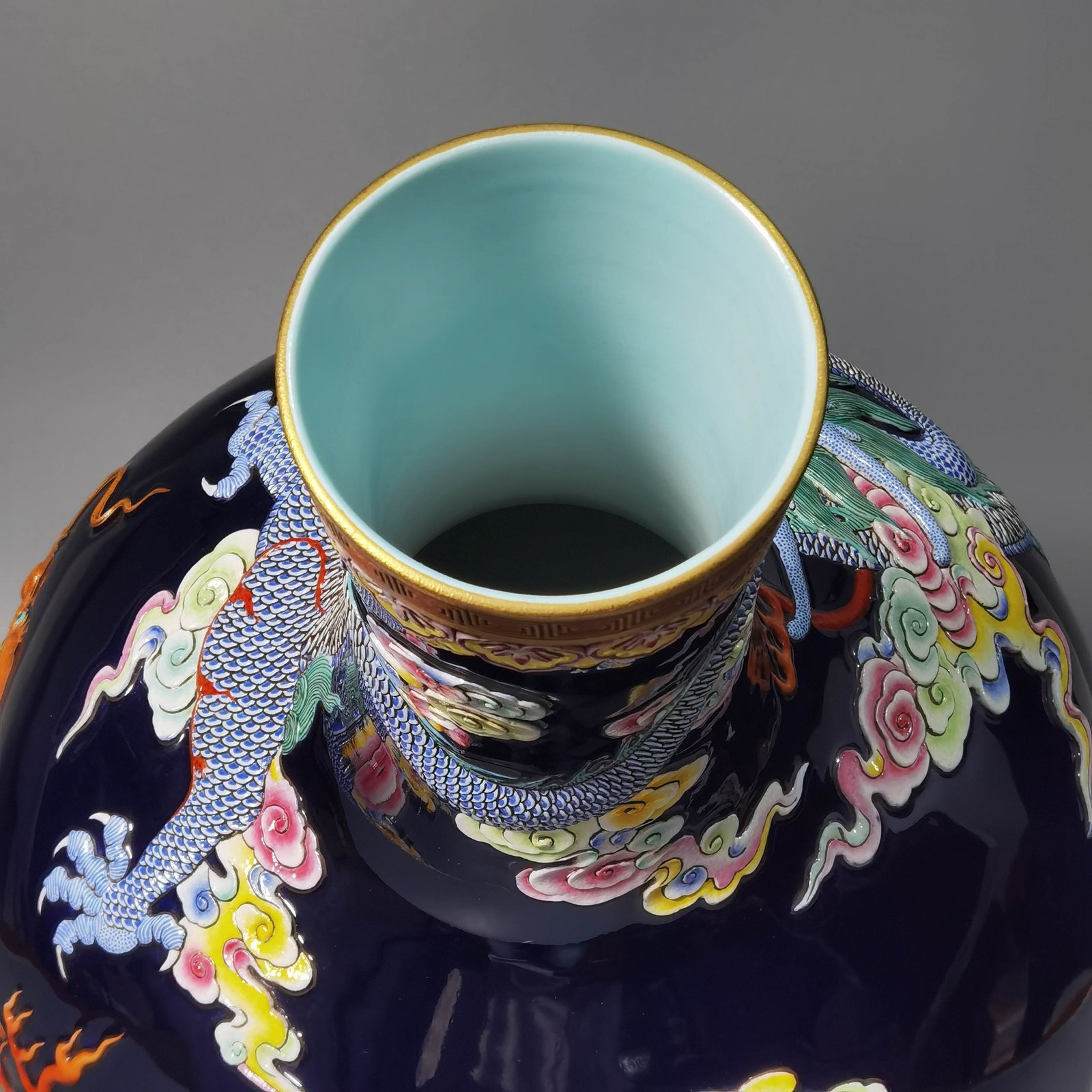 Qing Dynasty Qianlong blue glaze carving pastel gold-painted sea water dragon celestial sphere bottle