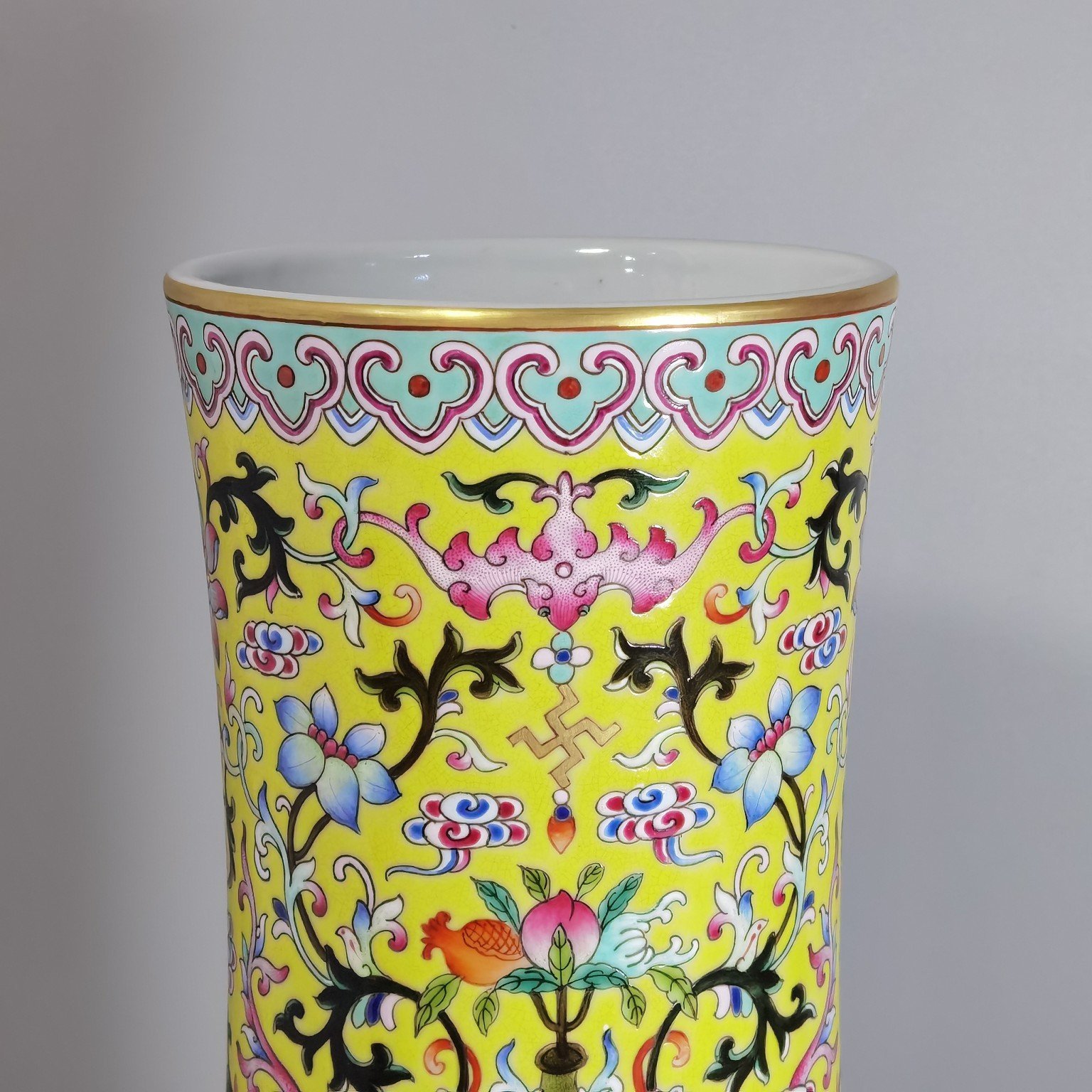 Qing Dynasty Qianlong pastel yellow ground and dark eight immortals entwining lotus vase
