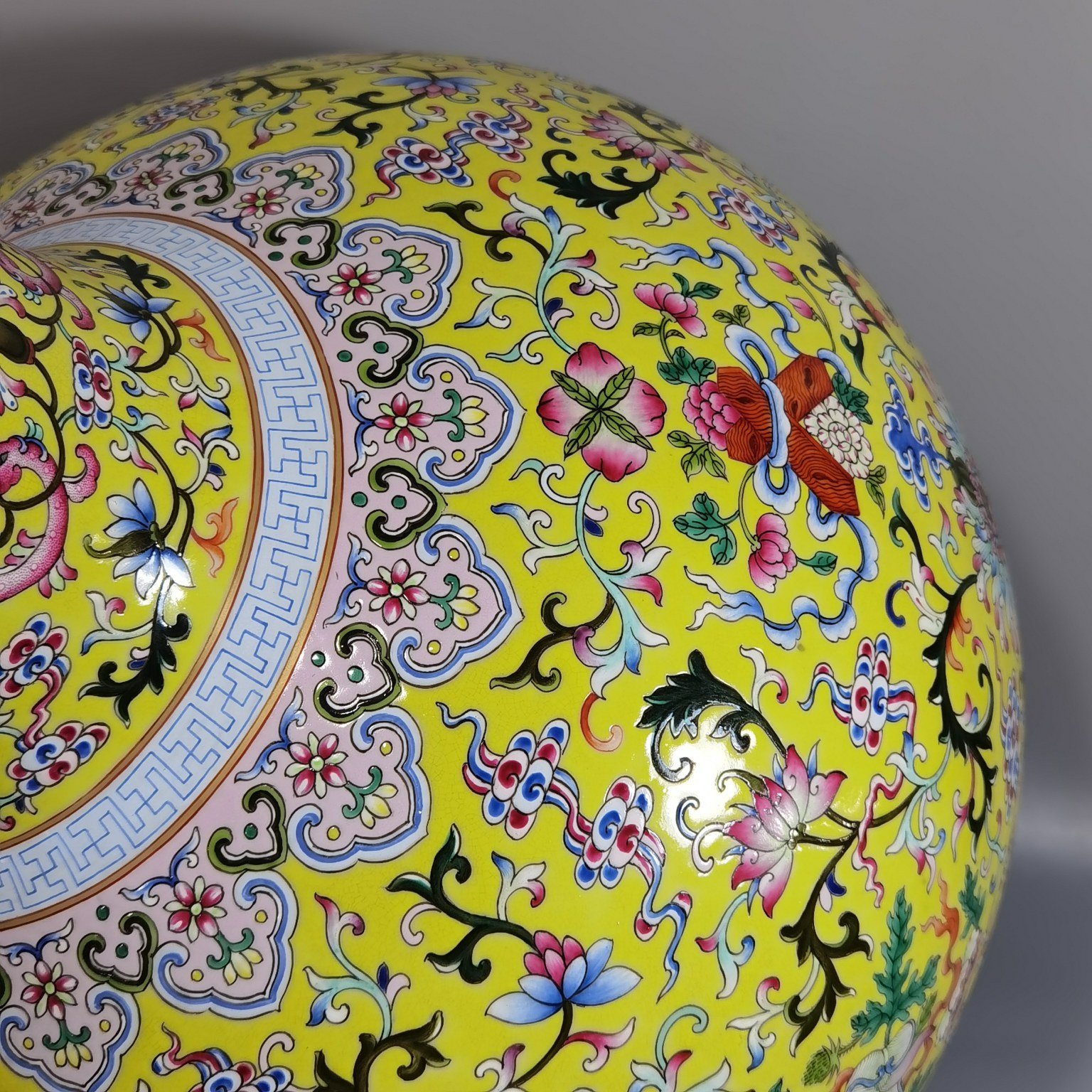 Qing Dynasty Qianlong pastel yellow ground and dark eight immortals entwining lotus vase