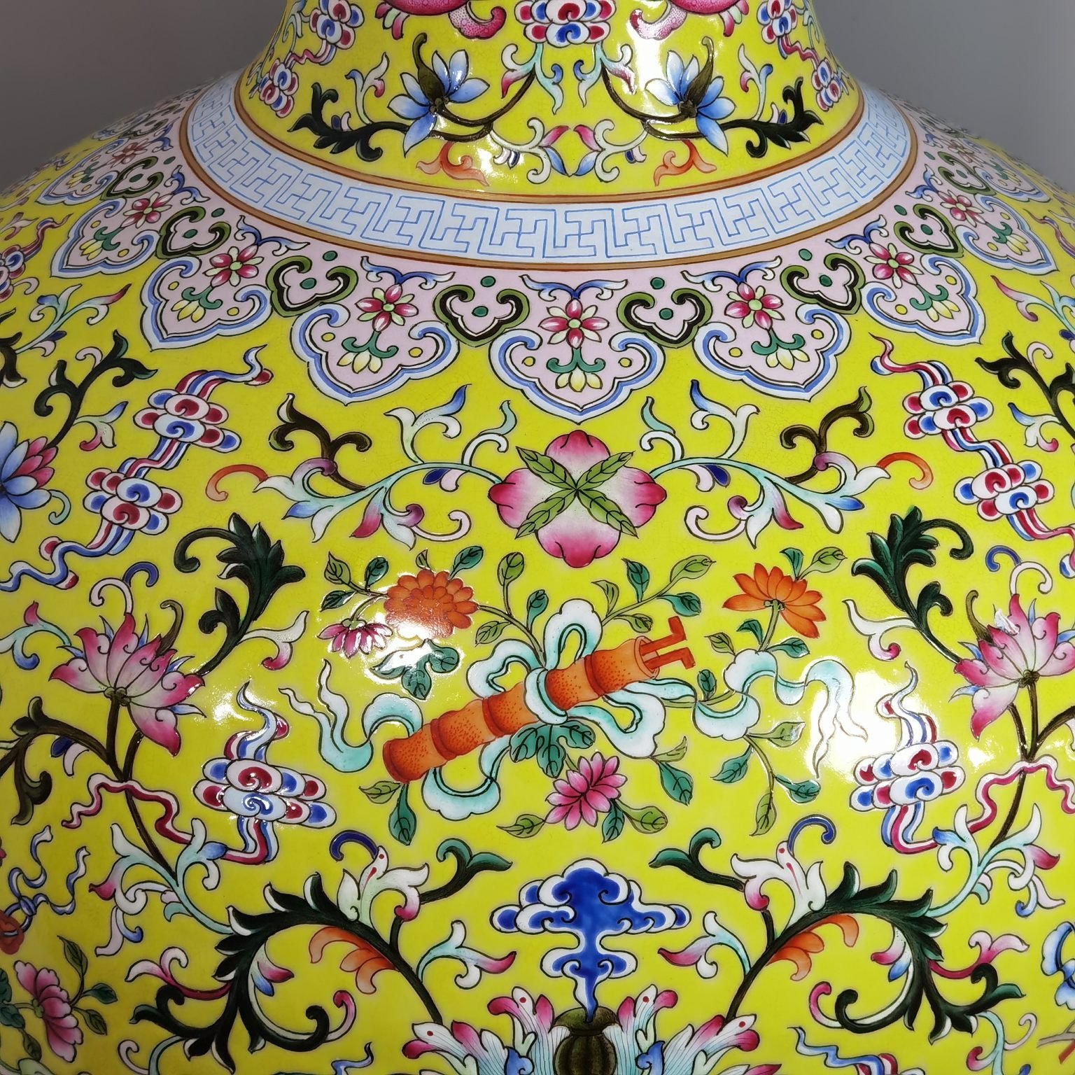 Qing Dynasty Qianlong pastel yellow ground and dark eight immortals entwining lotus vase