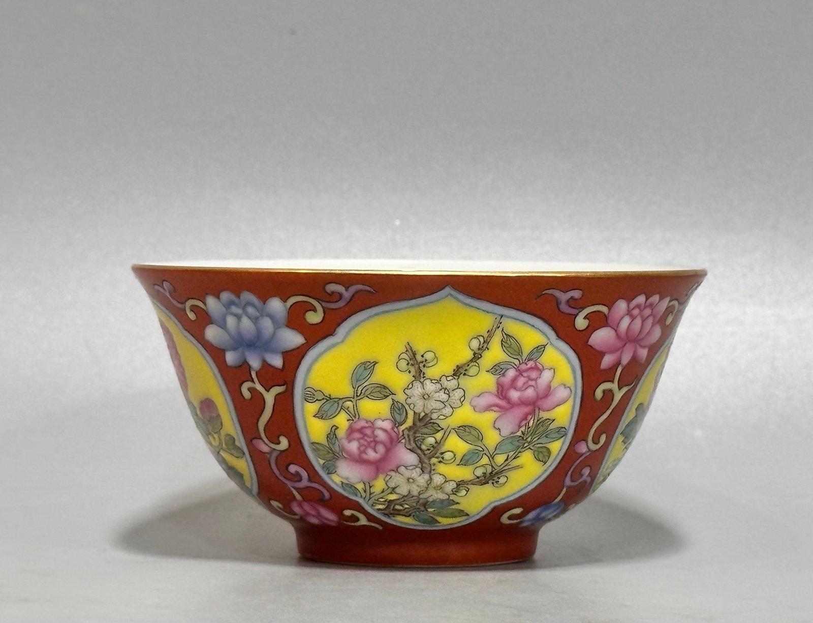 Oing Dynasty Yongzheng year carmine red cup with window opening and floral pattern