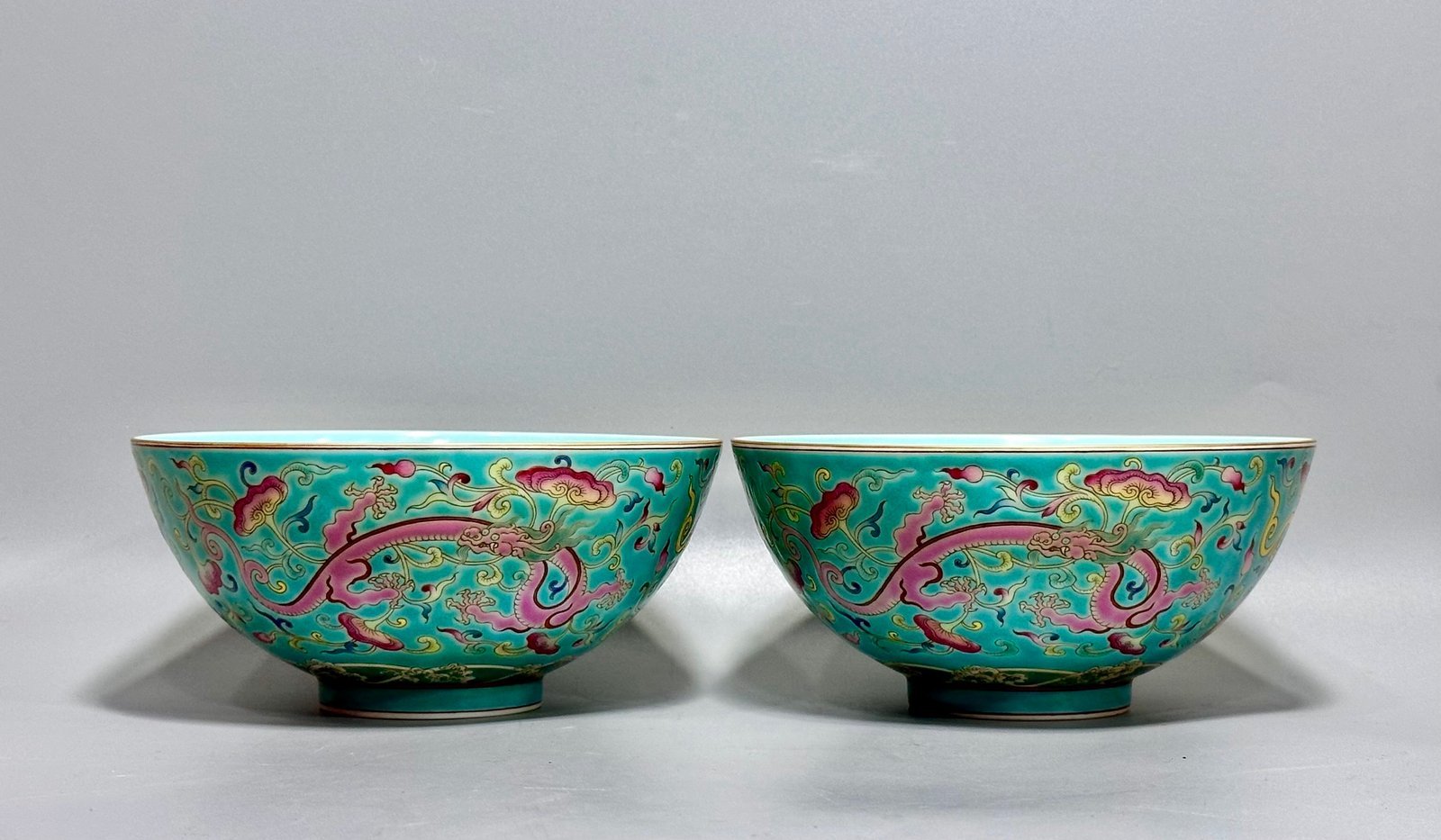 Oing Dynasty Yongzheng floral bowl with pastel grass and dragon patterns