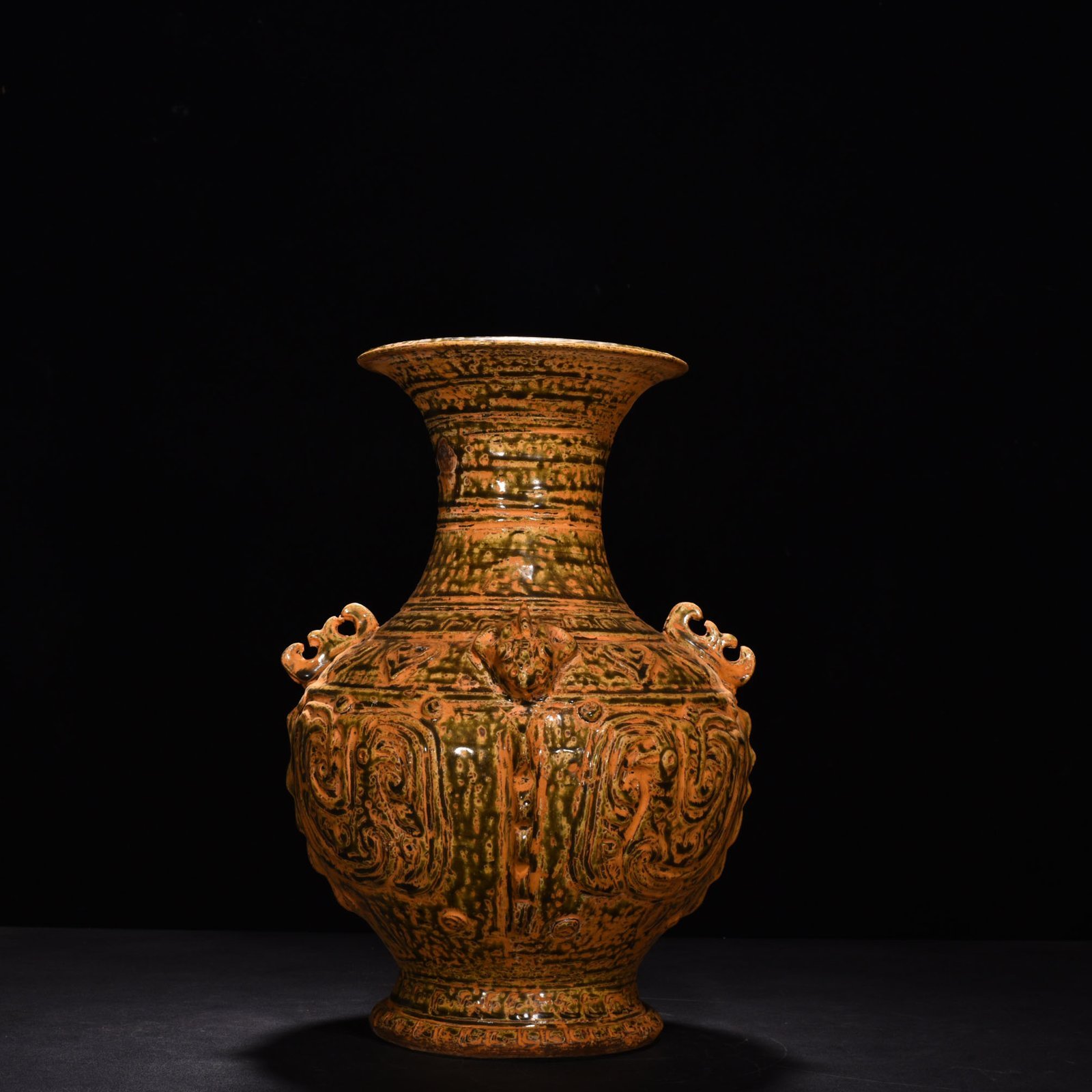 Jin Dynasty Yue kiln celadon vase with Kui dragon and animal ears