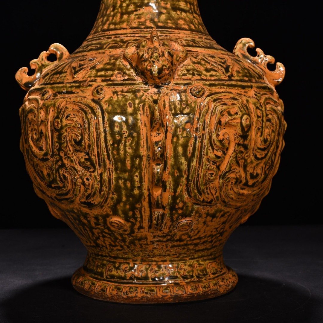 Jin Dynasty Yue kiln celadon vase with Kui dragon and animal ears