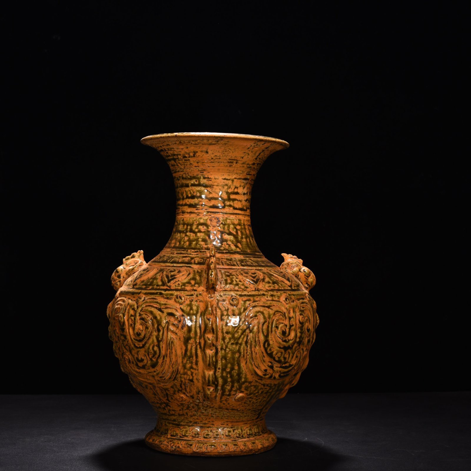 Jin Dynasty Yue kiln celadon vase with Kui dragon and animal ears