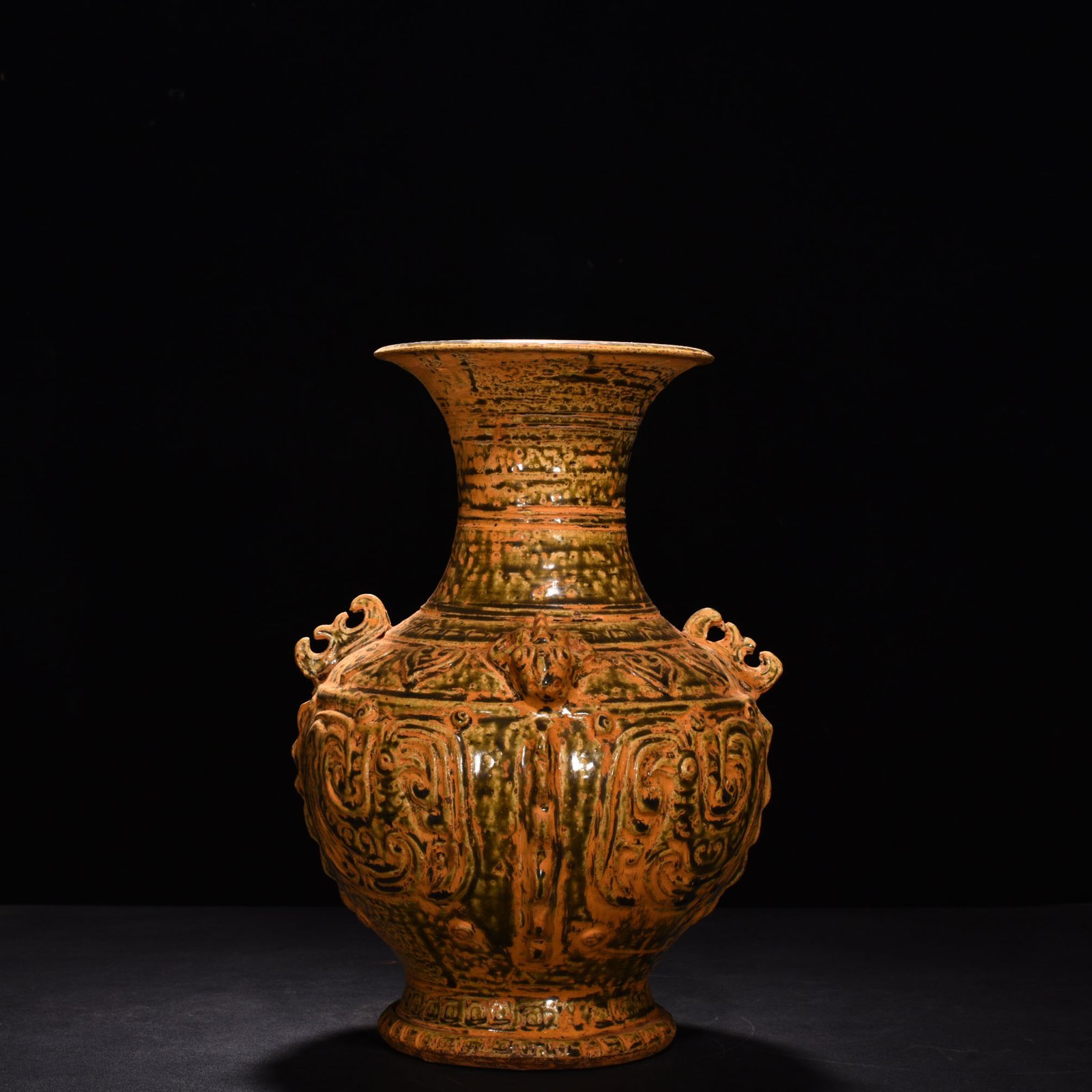 Jin Dynasty Yue kiln celadon vase with Kui dragon and animal ears