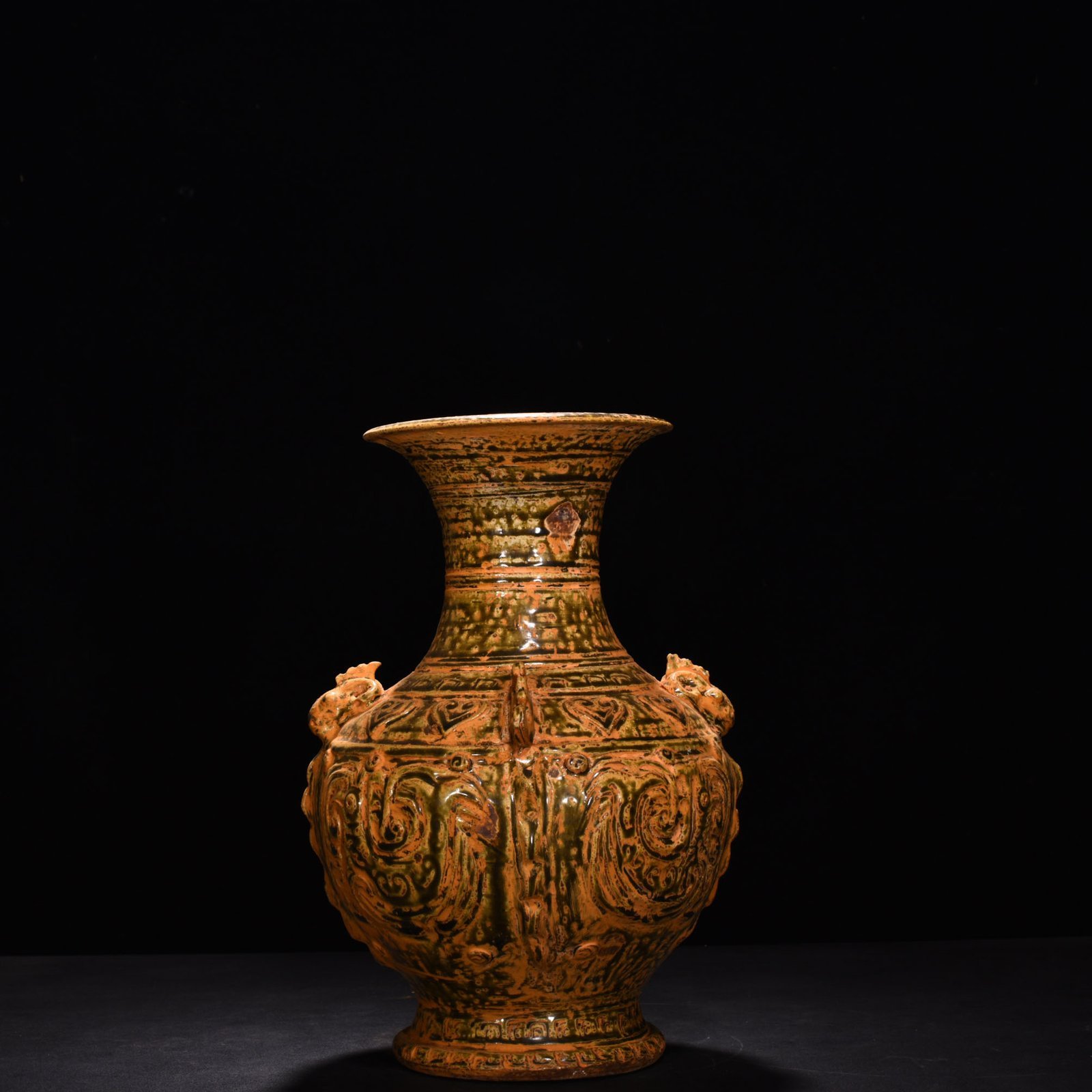 Jin Dynasty Yue kiln celadon vase with Kui dragon and animal ears