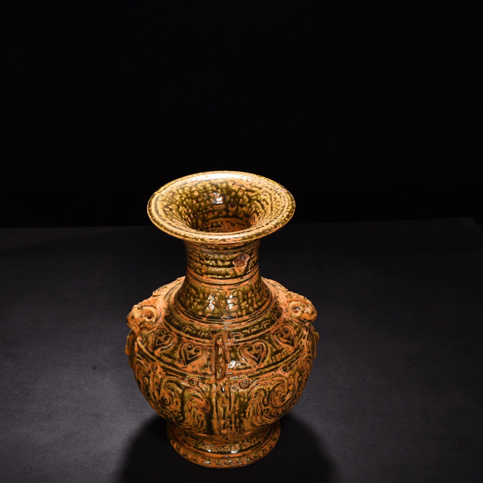 Jin Dynasty Yue kiln celadon vase with Kui dragon and animal ears