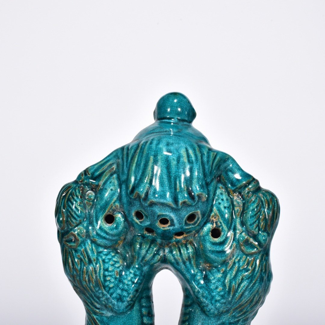 Five Dynasties Chai porcelain peacock green glaze lion playing boy vase
