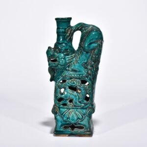 Five Dynasties Chai porcelain peacock green glaze lion and beast candlestick