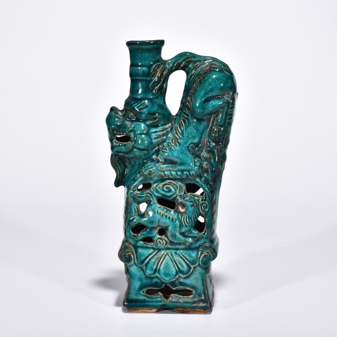 Five Dynasties Chai porcelain peacock green glaze lion and beast candlestick