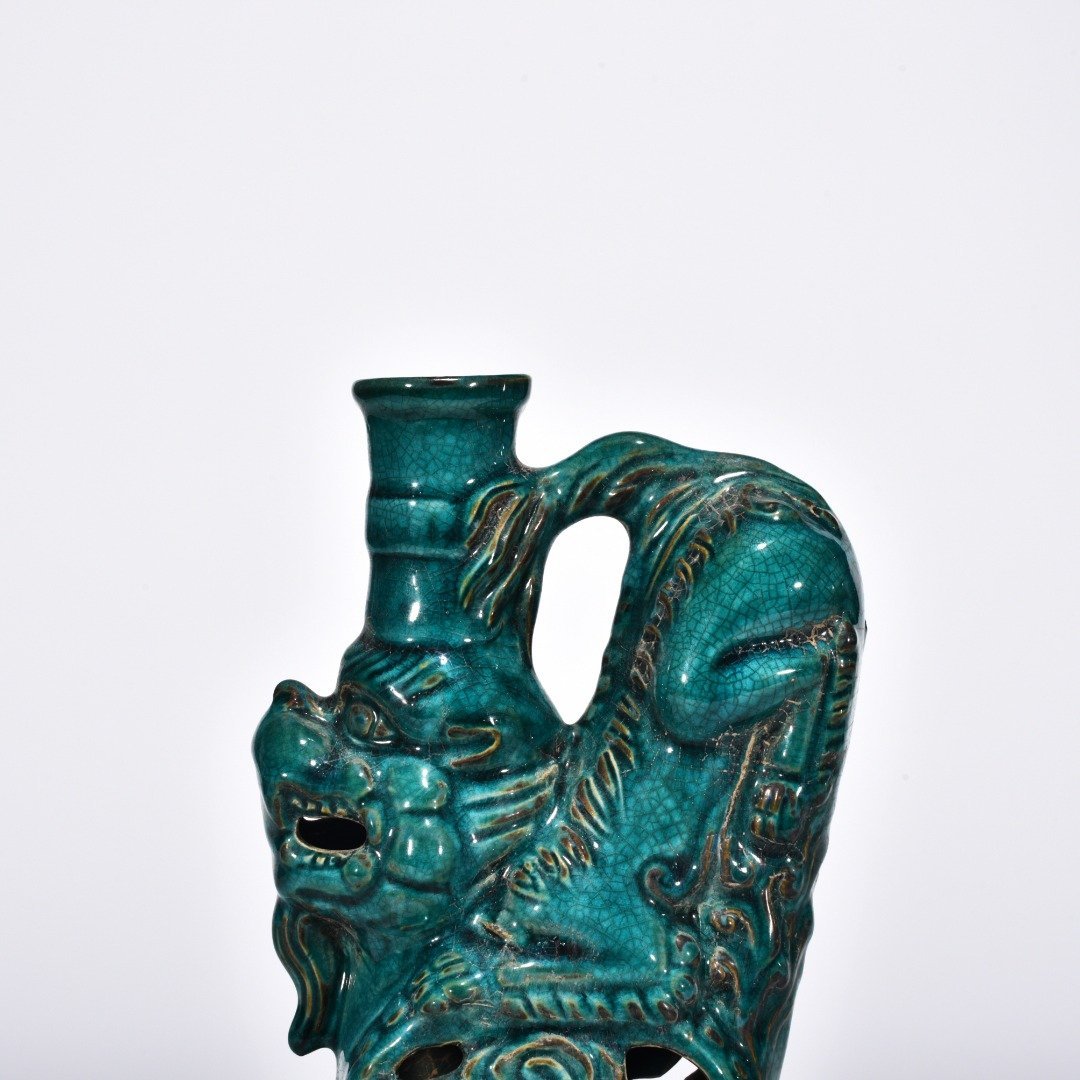 Five Dynasties Chai porcelain peacock green glaze lion and beast candlestick