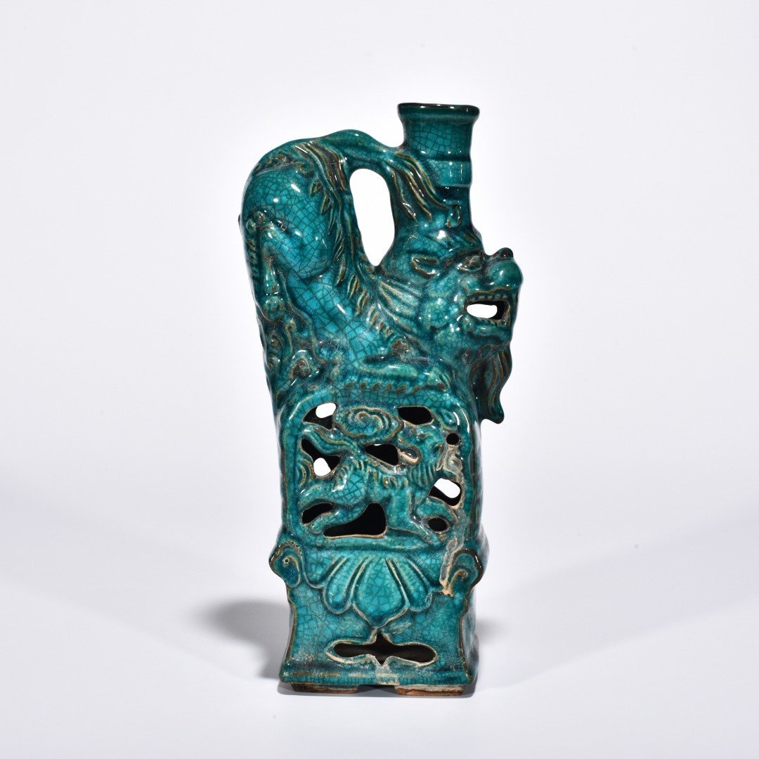 Five Dynasties Chai porcelain peacock green glaze lion and beast candlestick