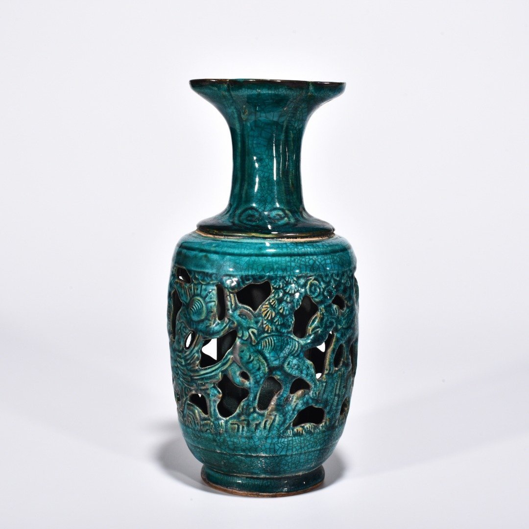 Five Dynasties Chai porcelain peacock green glaze hollow bottle with auspicious animal